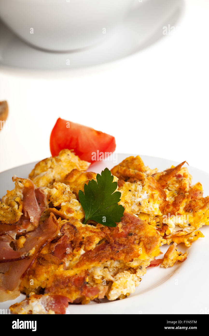 scrambled eggs and bun on a plate isolated on white Stock Photo - Alamy