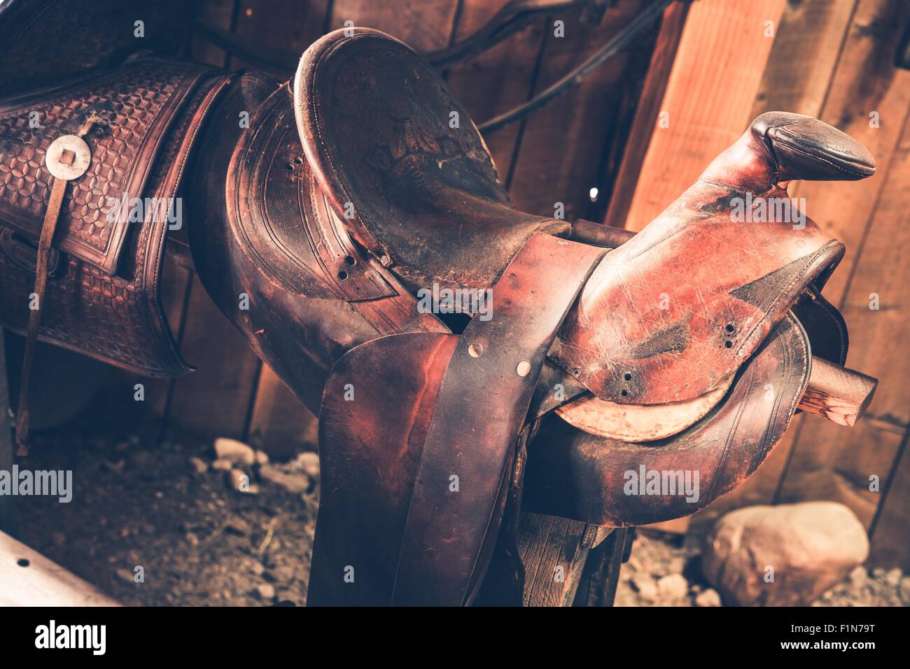Brown Leather Saddle Closeup. Aged Western Style Saddle. Stock Photo