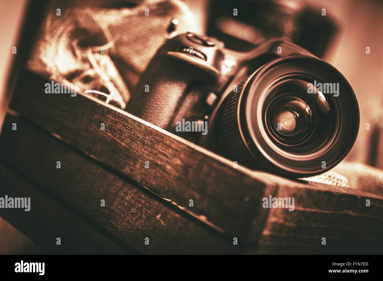 Digital Camera in the Wooden Box. Vintage Concept. Stock Photo
