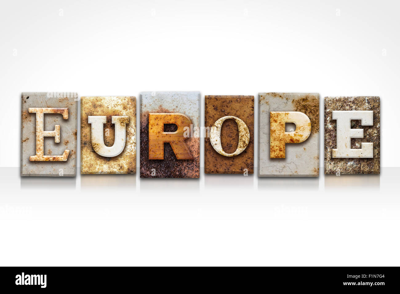 The word "EUROPE" written in rusty metal letterpress type isolated ...