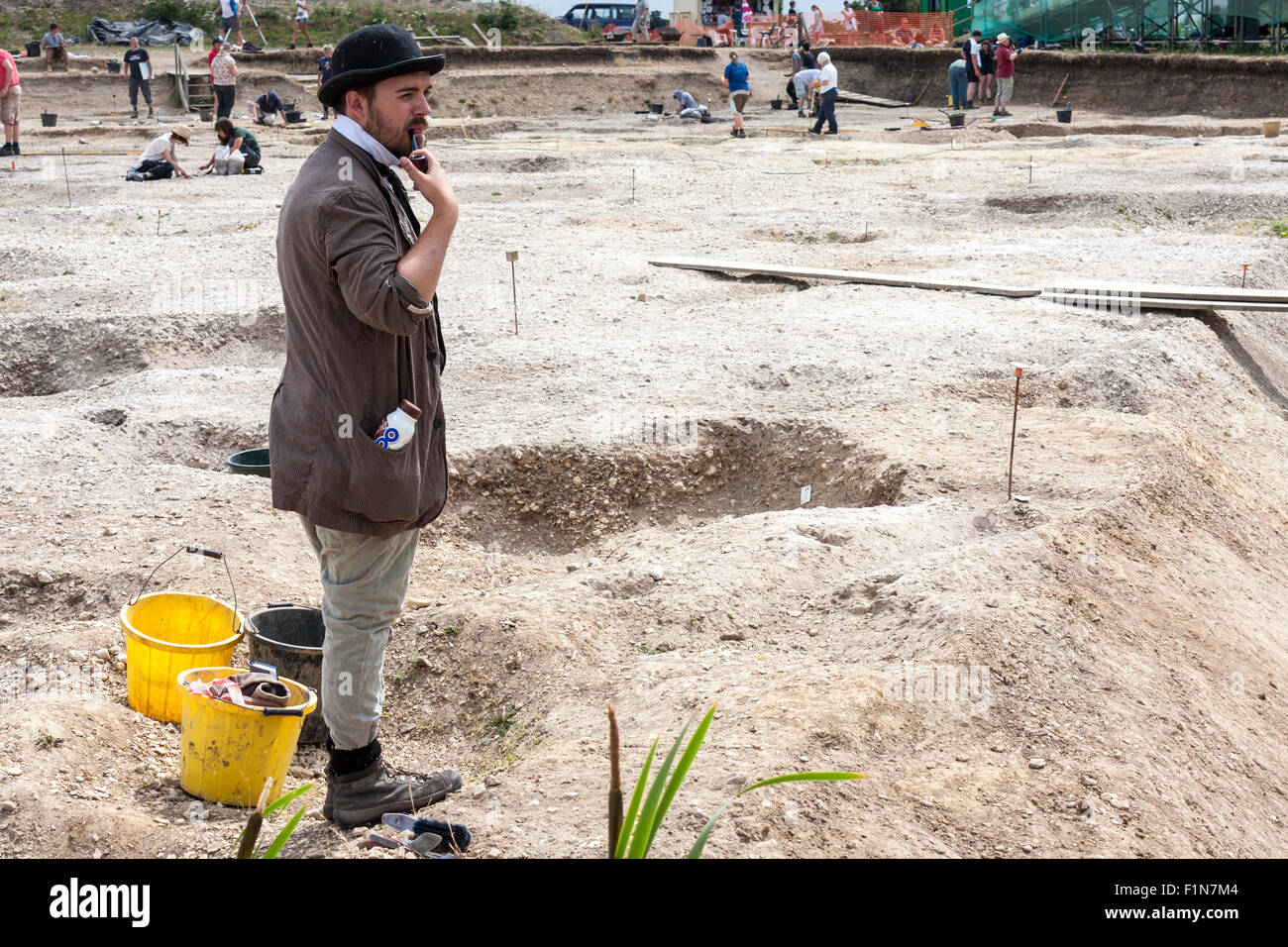 Archaeology student from the University of Reading dressed as a Victorian archaeologist at the annual open day at the Roman town Stock Photo