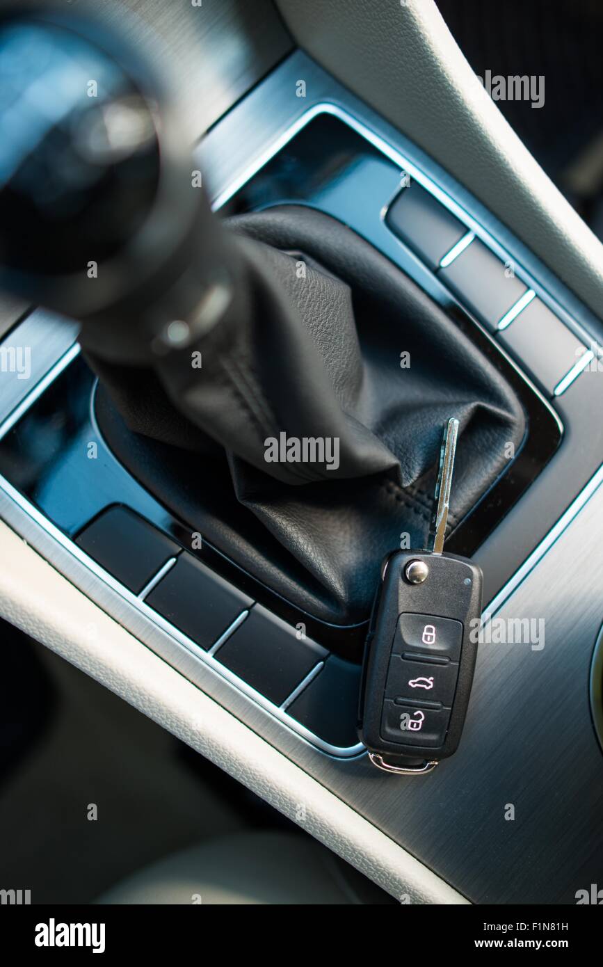 Modern Car Keys Laying Near Manual Transmission Stick Shift. Car Driving Concept Photography. Stock Photo