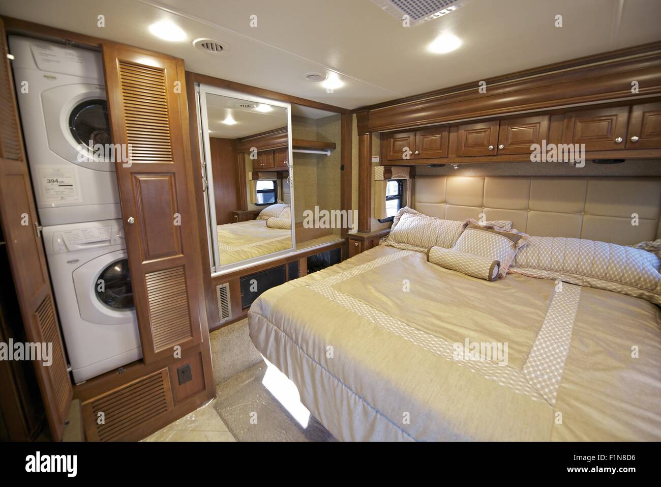 Recreation Vehicle Bedroom Interior With Washer And Dryer In