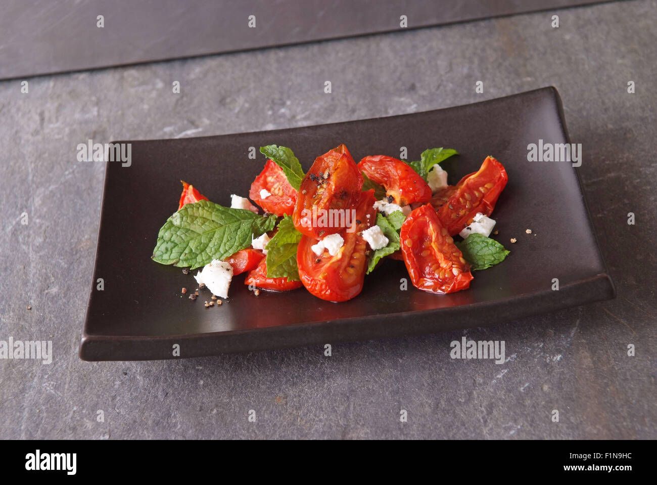 Semidried tomatoes with feta cheese & rocket Stock Photo Alamy