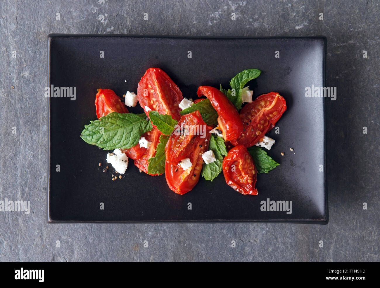 Semidried tomatoes with feta cheese & rocket Stock Photo Alamy