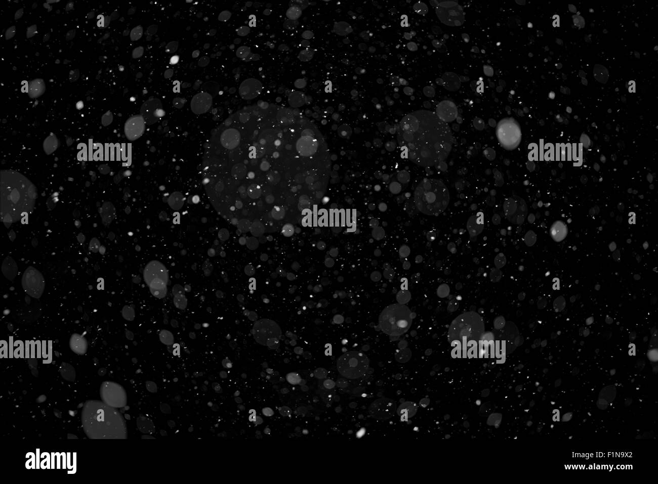 High Resolution Real Heavy Falling Snow Isolated on Solid Black Background. Falling Snow Alpha Channel Version 1 - Heavy. Stock Photo