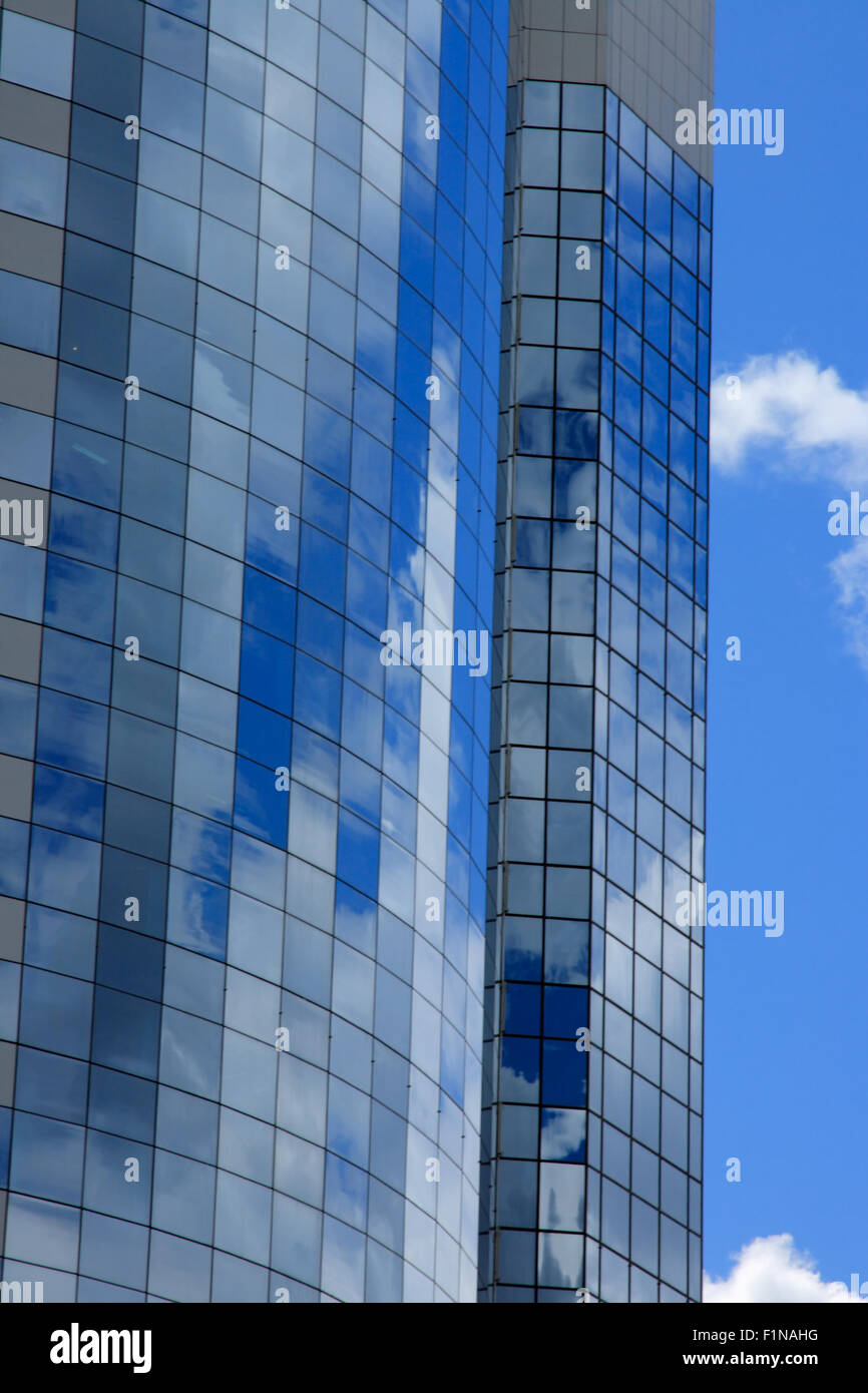 Office building windows reflect blue sky and clouds Stock Photo - Alamy