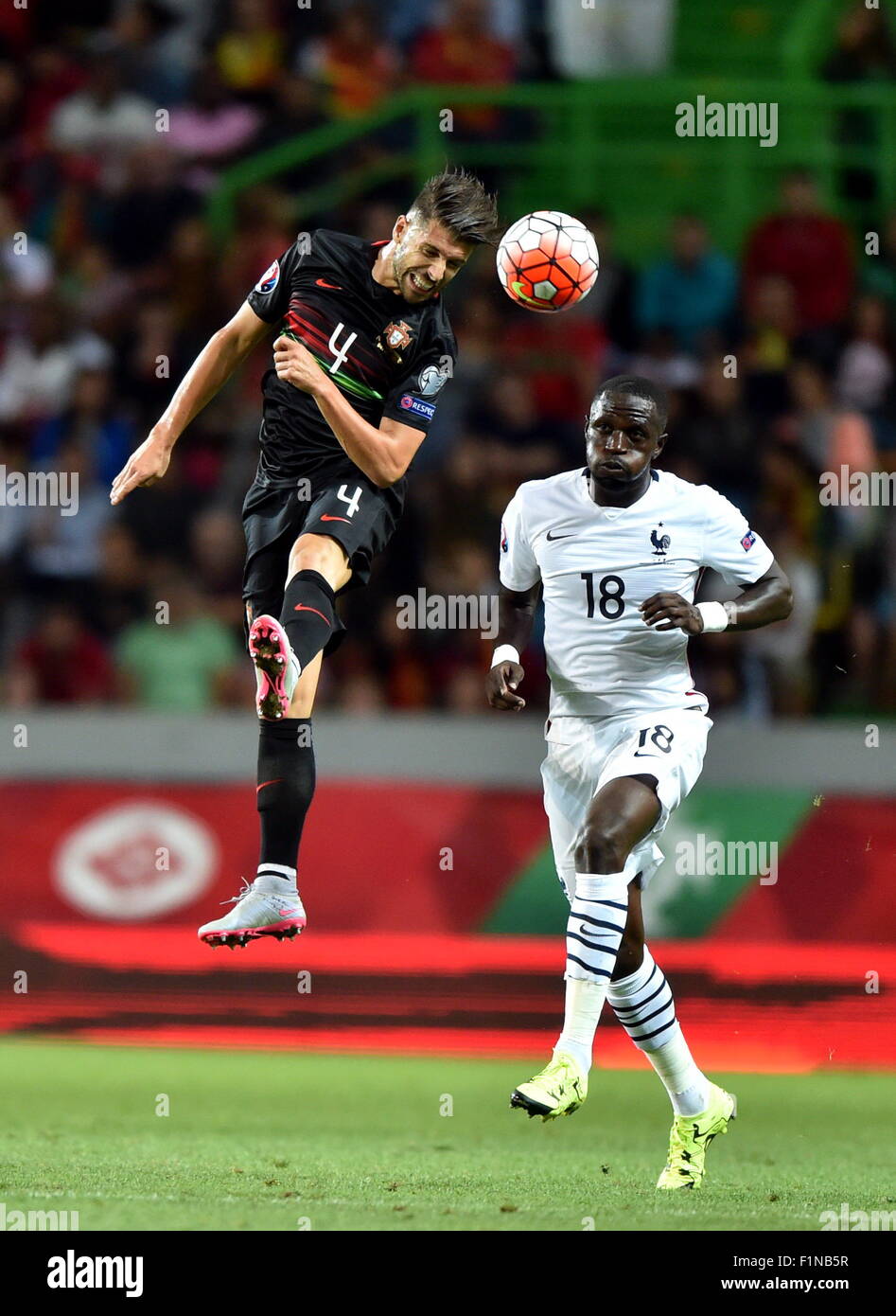 Lisbon, Portugal. 4th Sep, 2015. Miguel Veloso (L) of Portugal jumps for the ball during the Euro 2016 friendly football match against France in Lisbon, Portugal, Sept. 4, 2015. Portugal lost the match 0-1. Credit:  Zhang Liyun/Xinhua/Alamy Live News Stock Photo