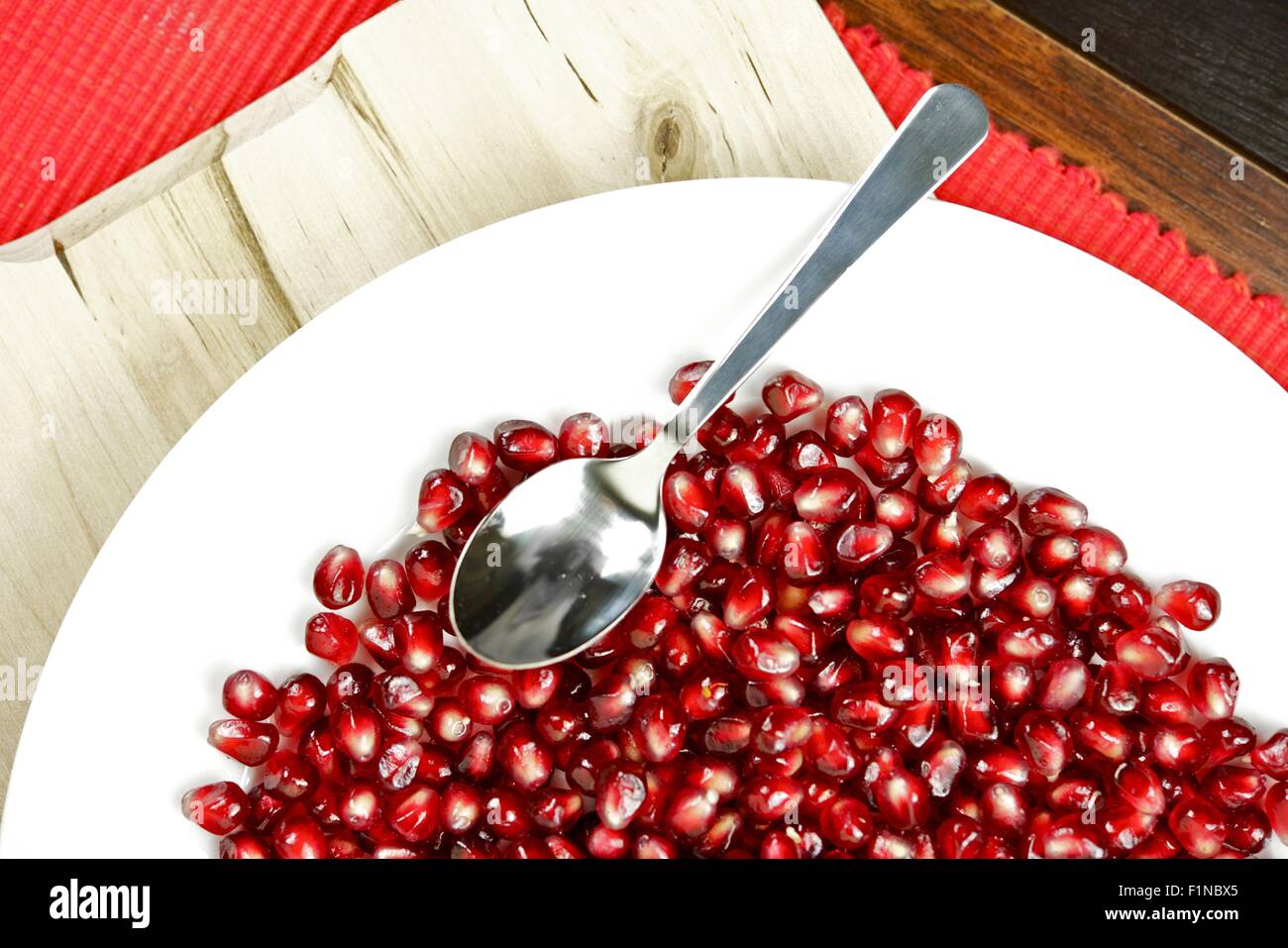 Fresh Pomegranate Seeds on Plate. Fresh Foods Photo Collection. Stock Photo