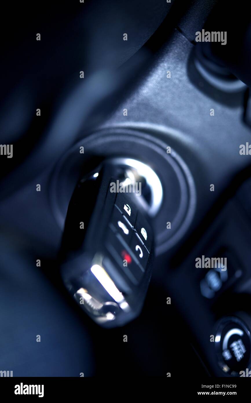 Car Keys in Ignition Studio Closeup / Vertical Photo. Modern Car Key