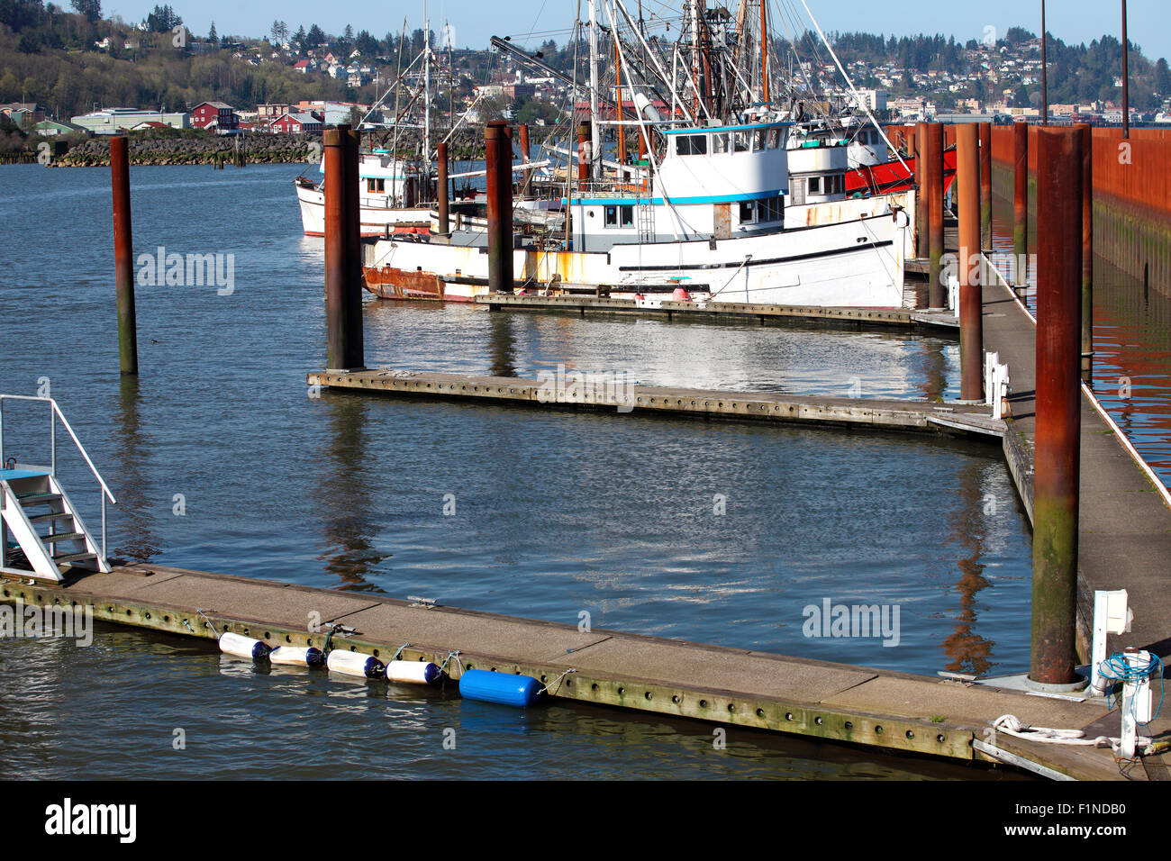 fishing boats moored and city neighborhood Astoria Oregon. Stock Photo