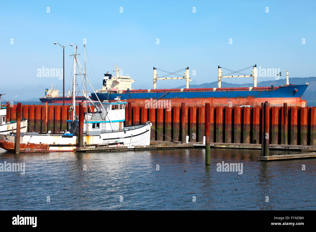 Cargo ships anchored in Astoria a major throwaway of trade lanes. Stock Photo