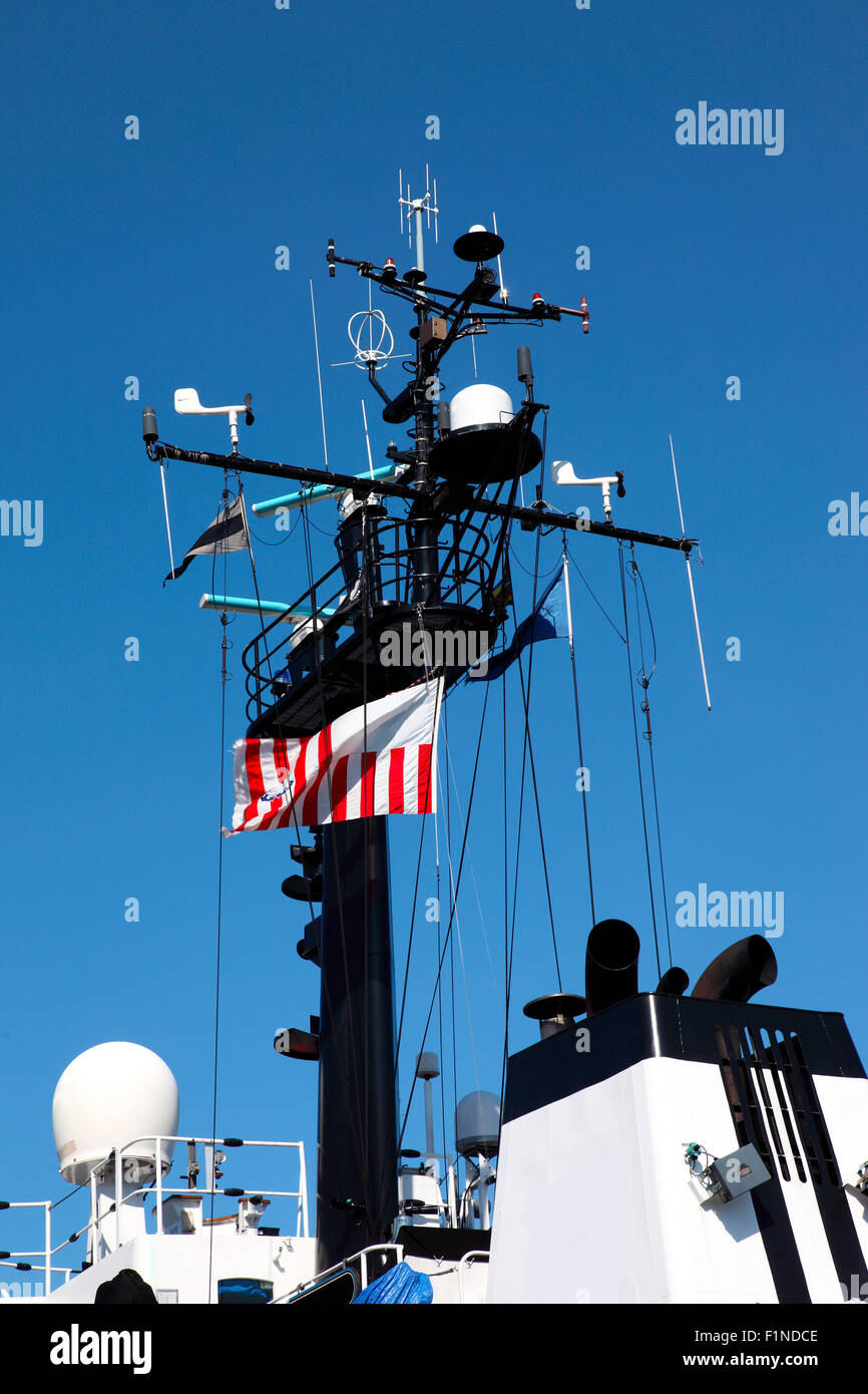 A coast guard ship mast decorated with electronics Stock Photo Alamy