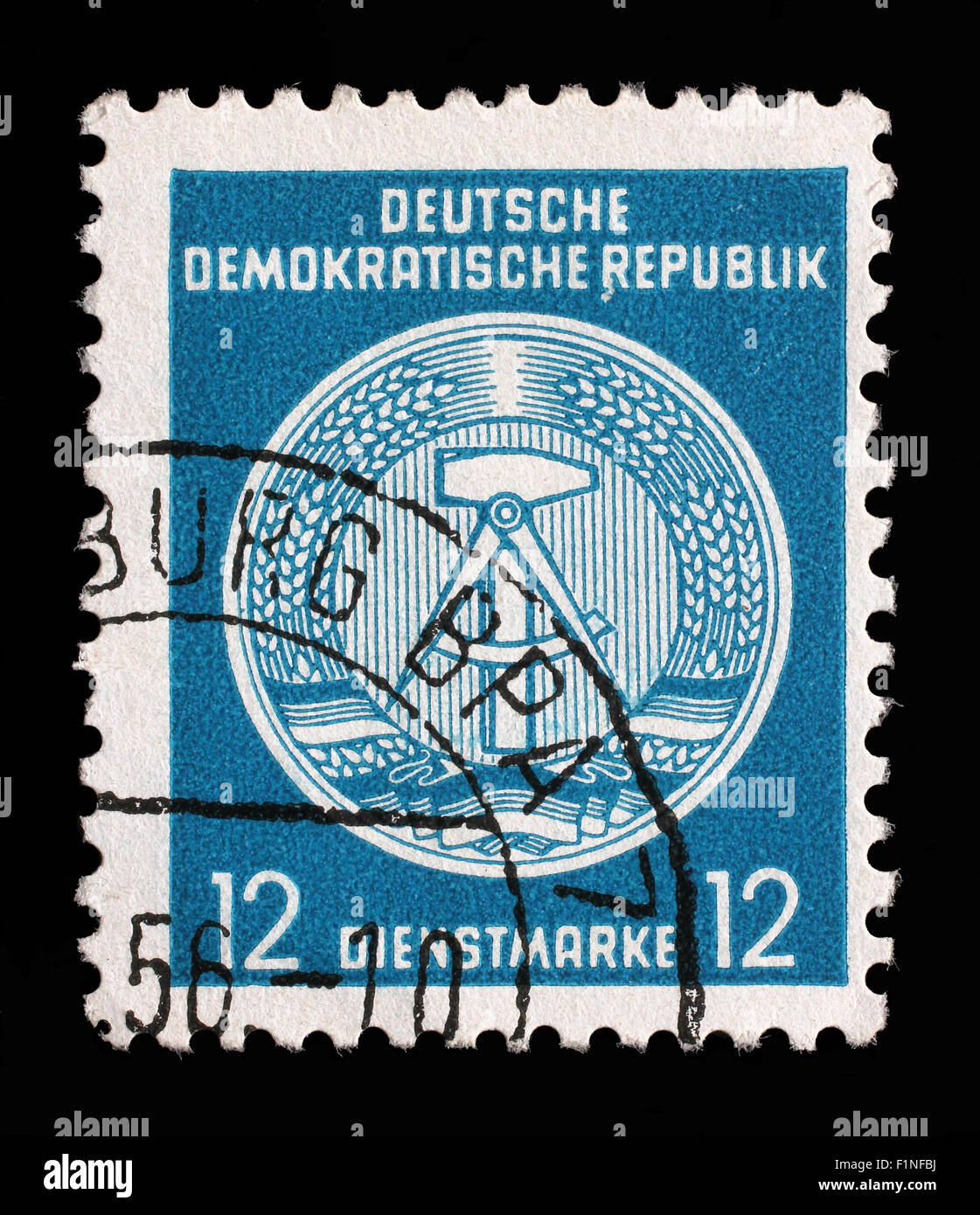 Stamp printed in GDR (German Democratic Republic - East Germany) shows DDR national coat of arms, circa 1952 Stock Photo