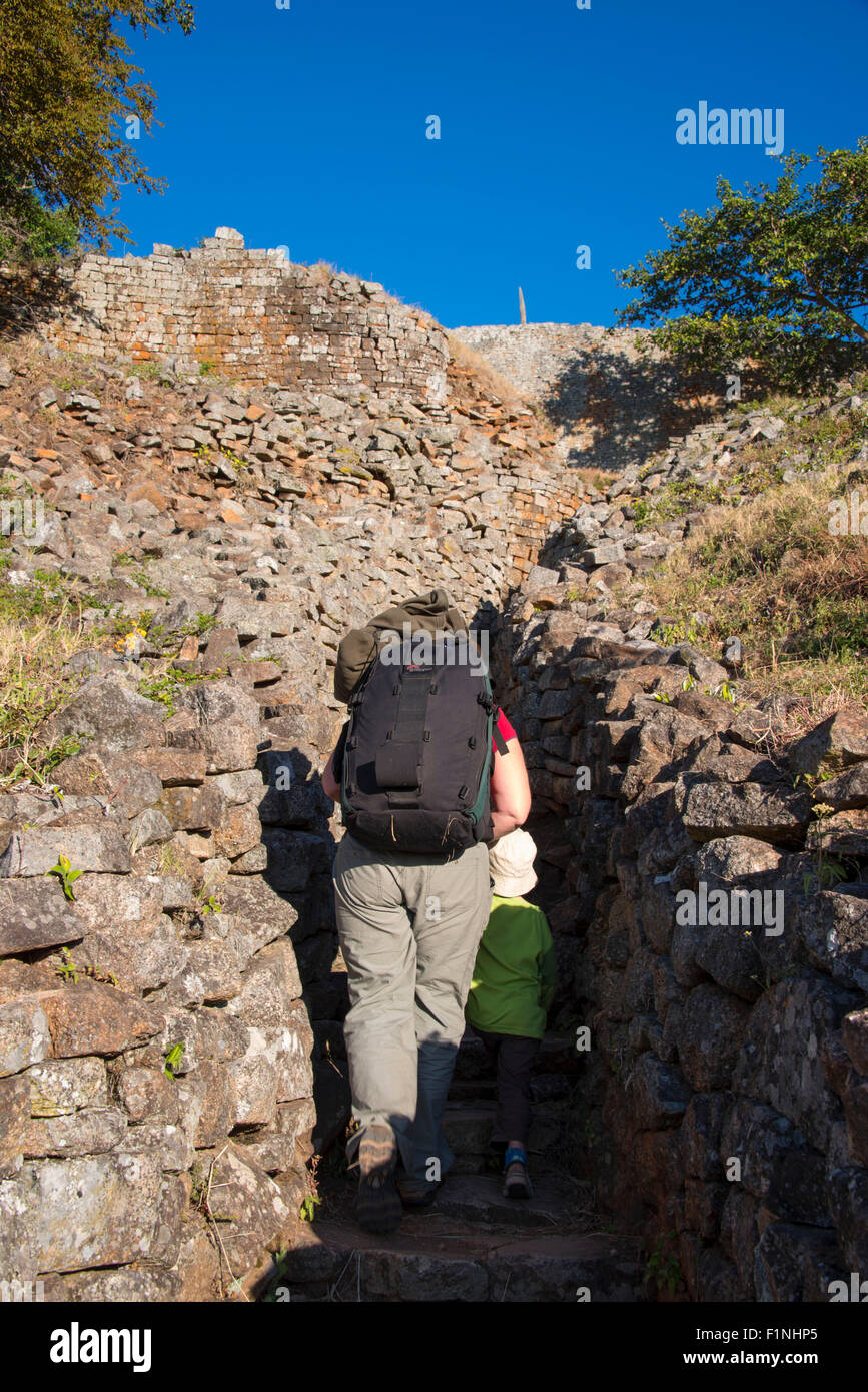 Great Zimbabwe ruins hill complex people climbing Stock Photo