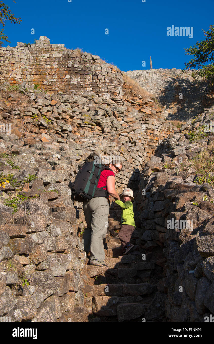 Great Zimbabwe ruins hill complex people climbing Stock Photo