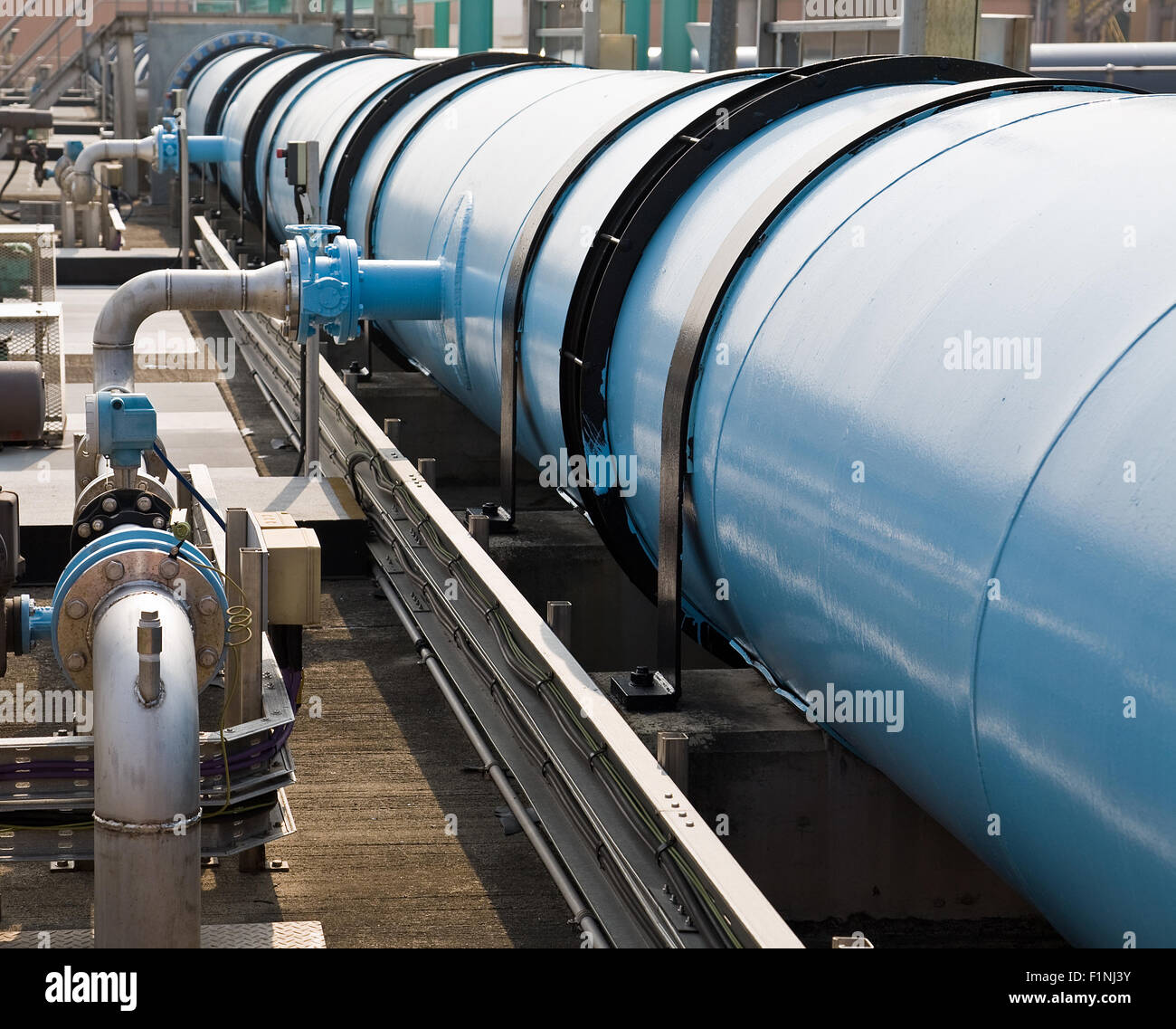 Large water pipe in a sewage treatment plant Stock Photo
