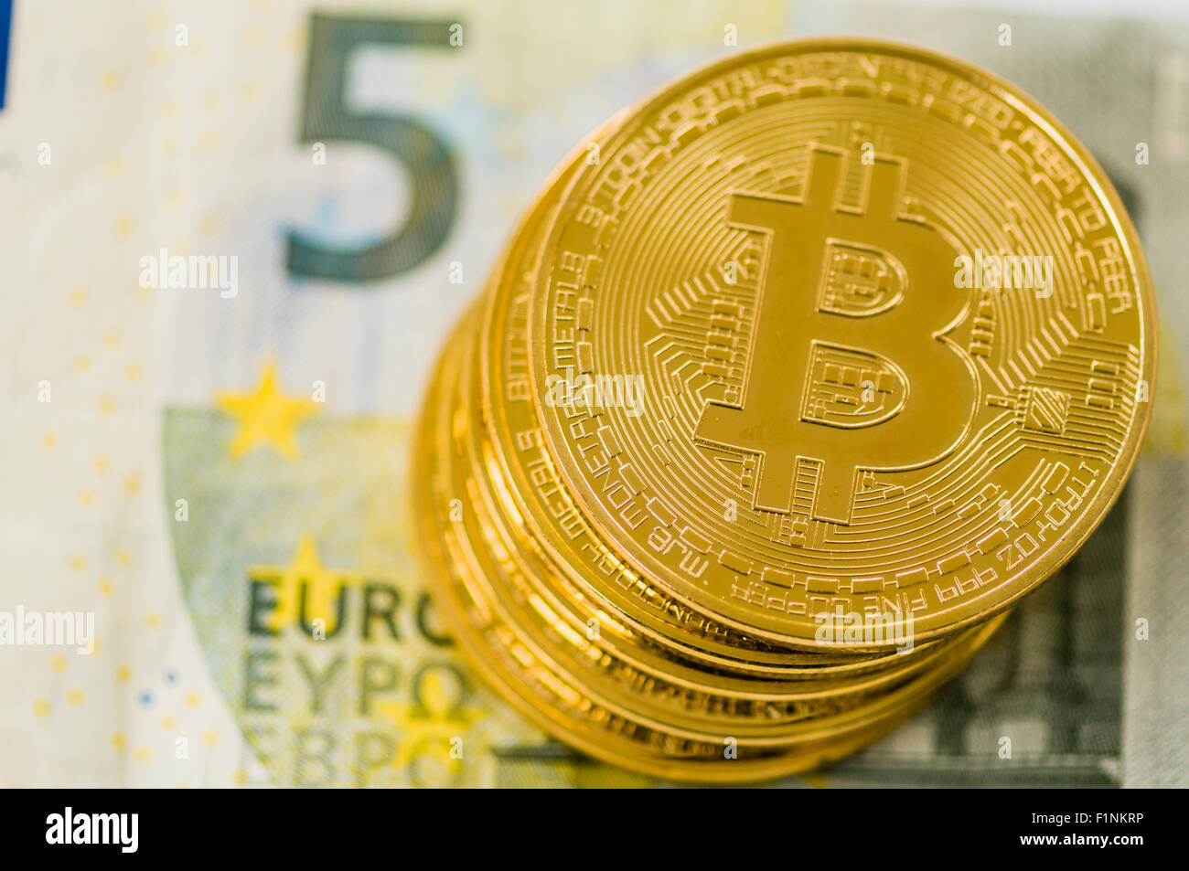 Bitcoins on a €5 five Euro banknote Stock Photo - Alamy