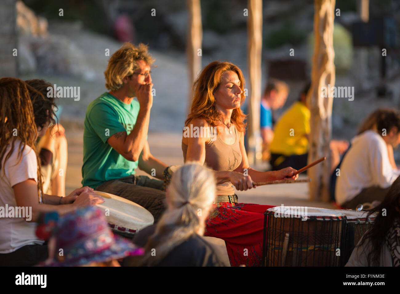 People drumming at sunset at Benirras Beach, Ibiza, Stock Photo