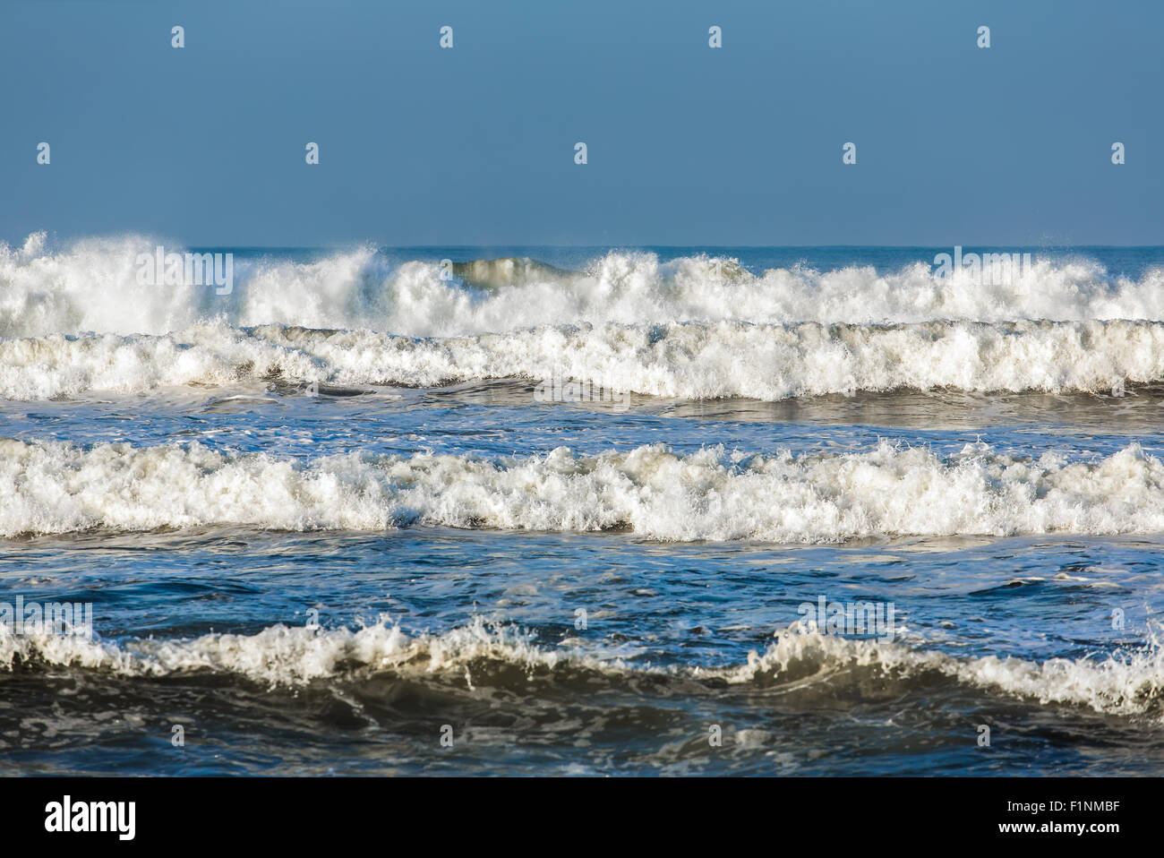 Storm waves breaking during windy day on Java, Indonesia Stock Photo ...