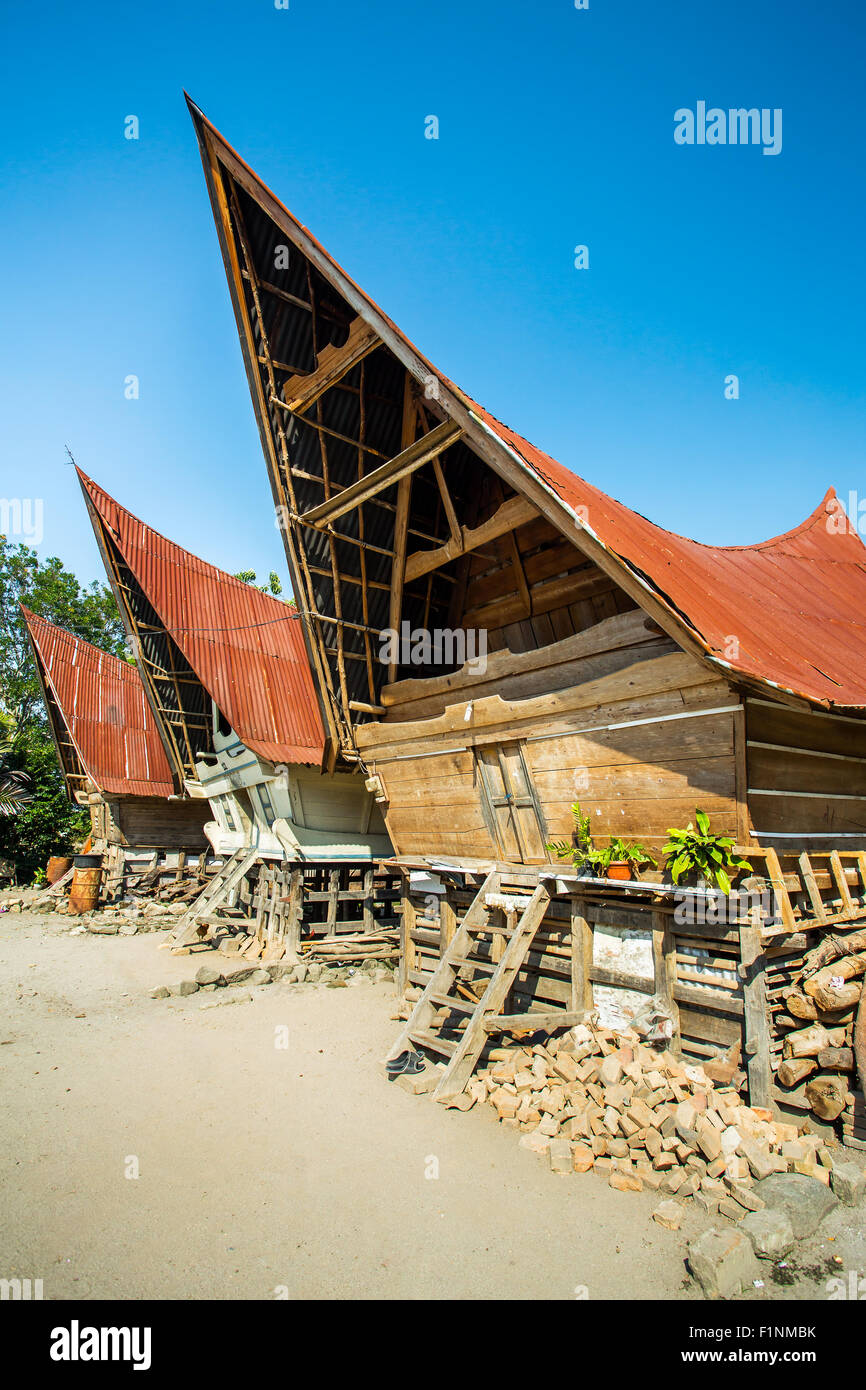 Batak houses on the Samosir island, lake Toba, Indonesia, North Sumatra, Stock Photo