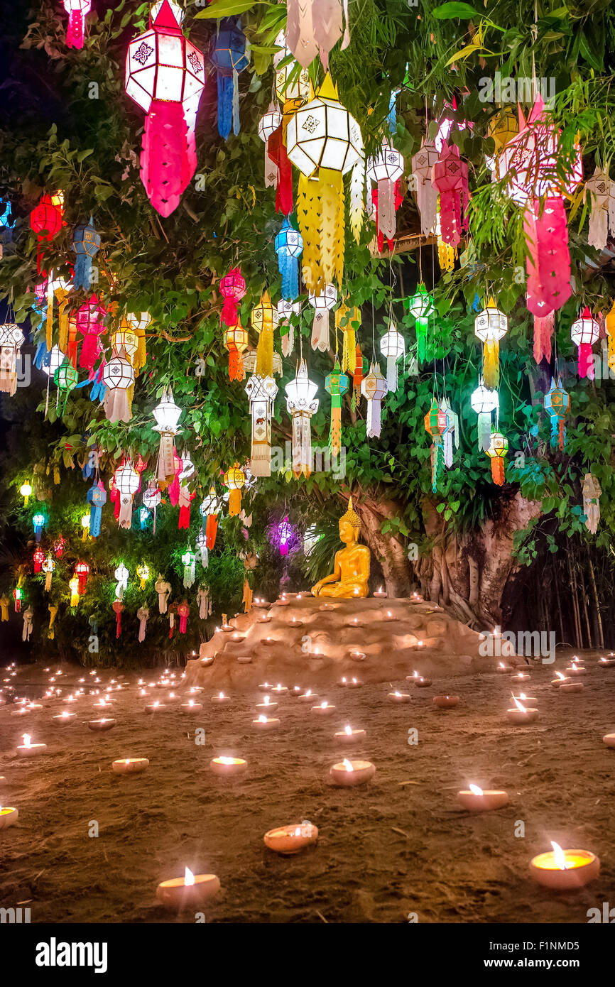 Loy Kratong Festival in Wat Pan Tao Temple, Chiangmai, Thailand. Buddha statue decorated with candles and colorful lamps Stock Photo
