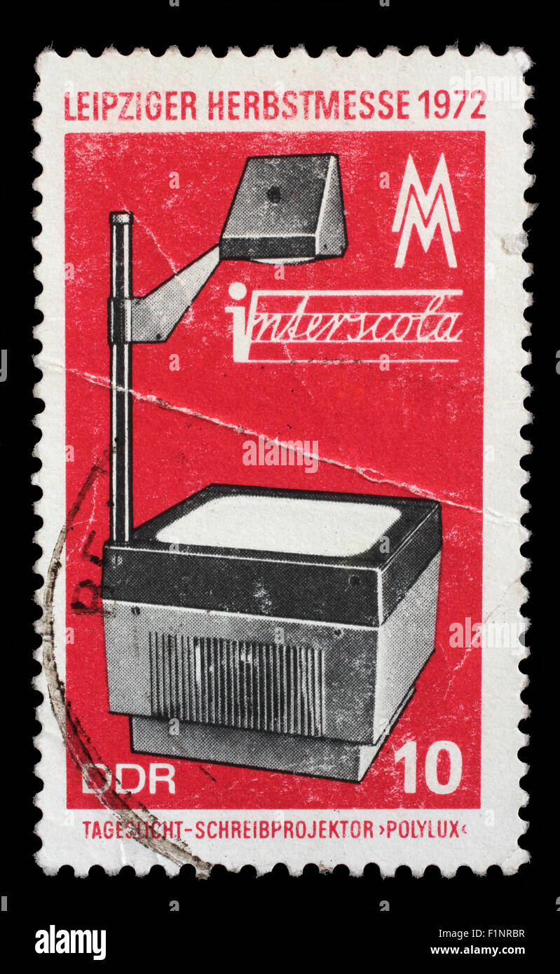 Stamp printed in GDR shows overhead projector, Leipzig Autumn Fair, circa 1972 Stock Photo