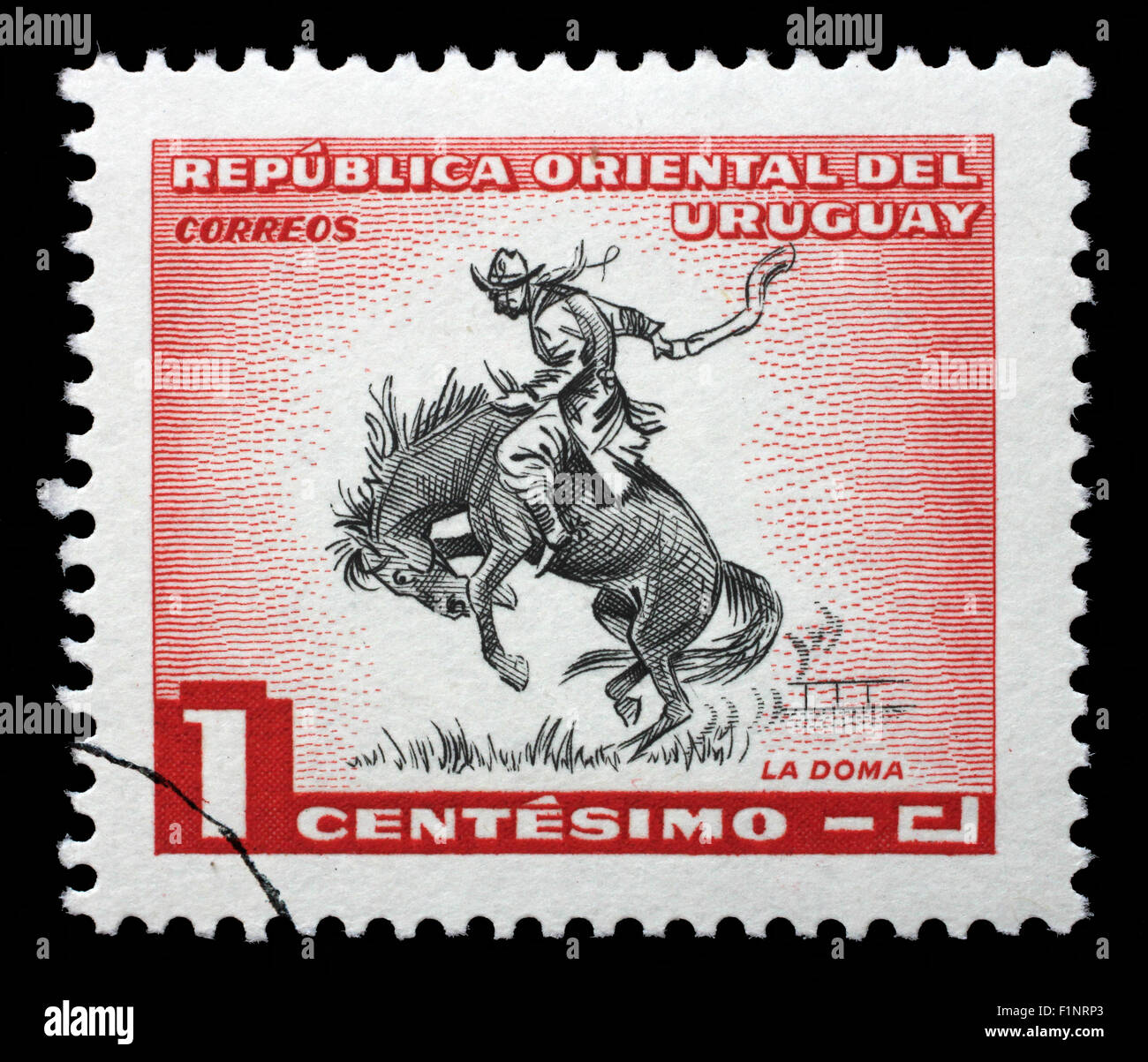 Stamp printed in Uruguay shows taming a horse, circa 1954. Stock Photo