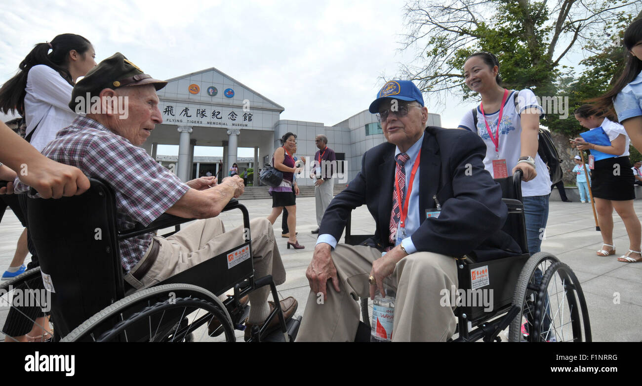 (150905) -- ZHIJIANG, Sept. 5, 2015 (Xinhua) -- Member of the U.S. 'Flying Tigers' air squadron Paul Crawford (R front) talks with veteran of the U.S. 14th Air Force David Thompson (L front) in front of the Flying Tigers Memorial Museum in Zhijiang, central China's Hunan Province, Sept. 5, 2015. Some veterans of the U.S. 'Flying Tigers' air squadron and their relatives visited the Flying Tigers Memorial Museum in Zhijiang Saturday. The Flying Tigers, officially known as the American Volunteer Group of the Chinese Air Force, were formed in 1941 and led by U.S. General Claire Lee Chennault to h Stock Photo