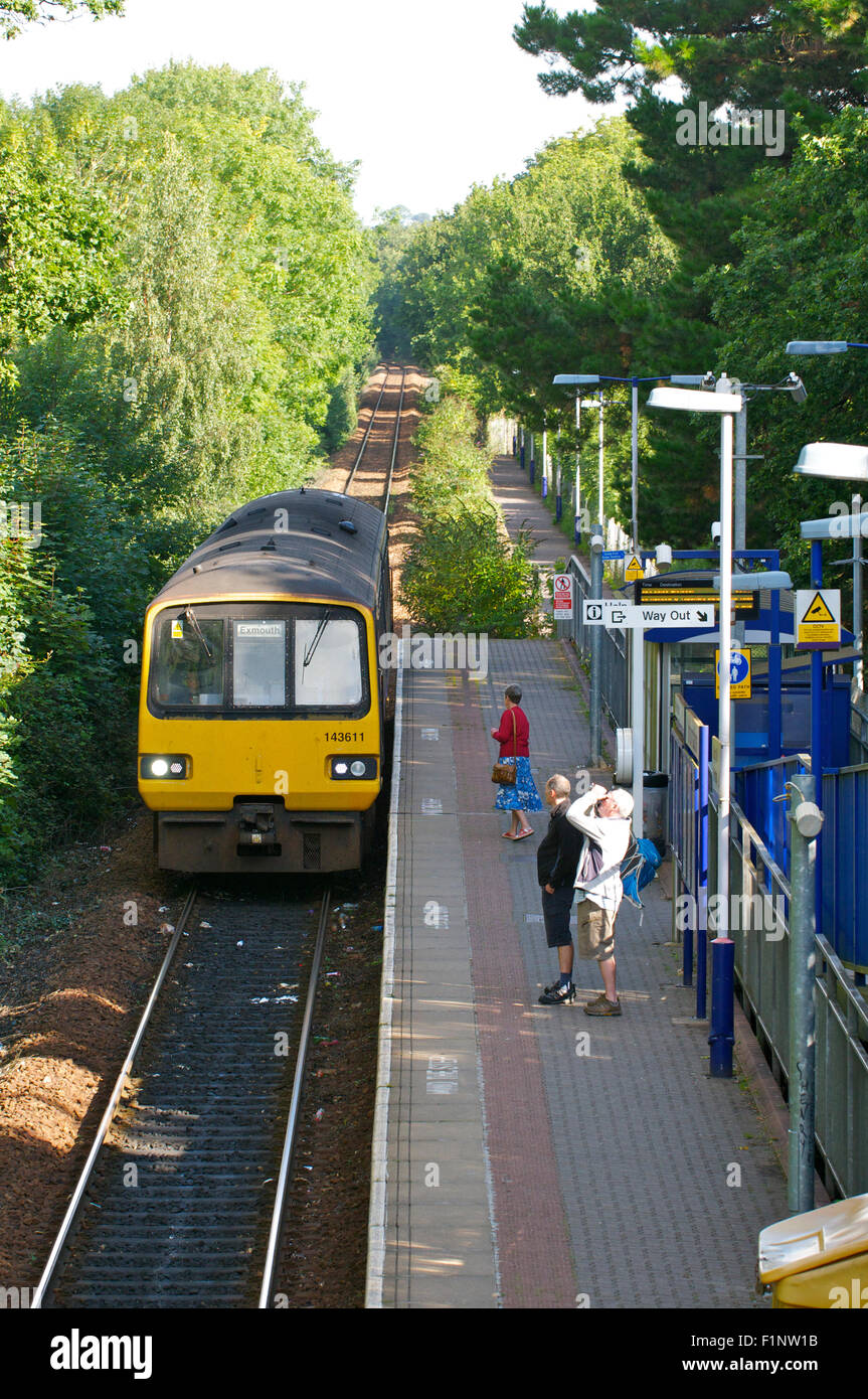 Train arriving at a suburban station, Devon, UK Stock Photo