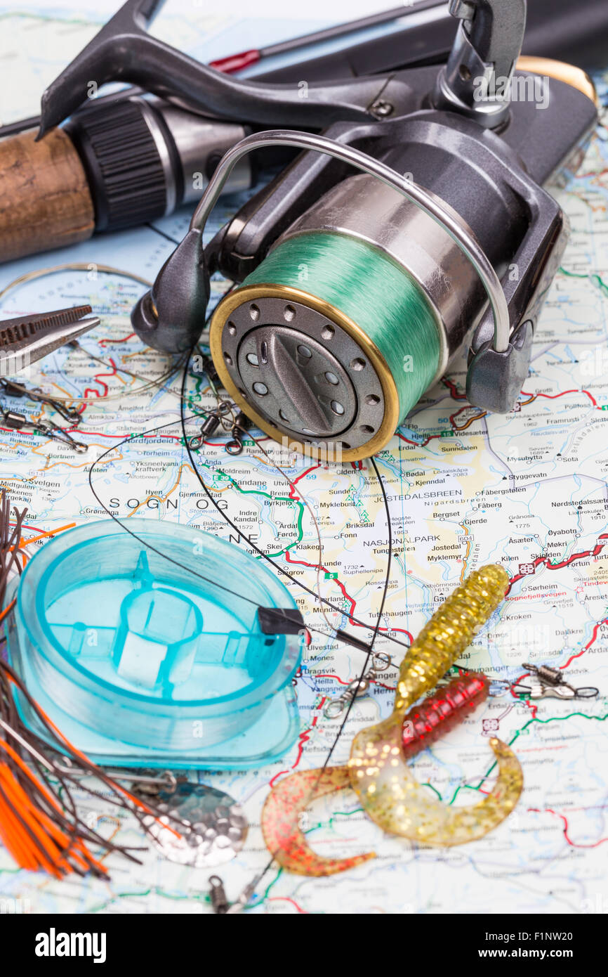 fishing tackles - rod, reel, line and lure on norway map background.  Prepare fishing route and to journey Stock Photo - Alamy