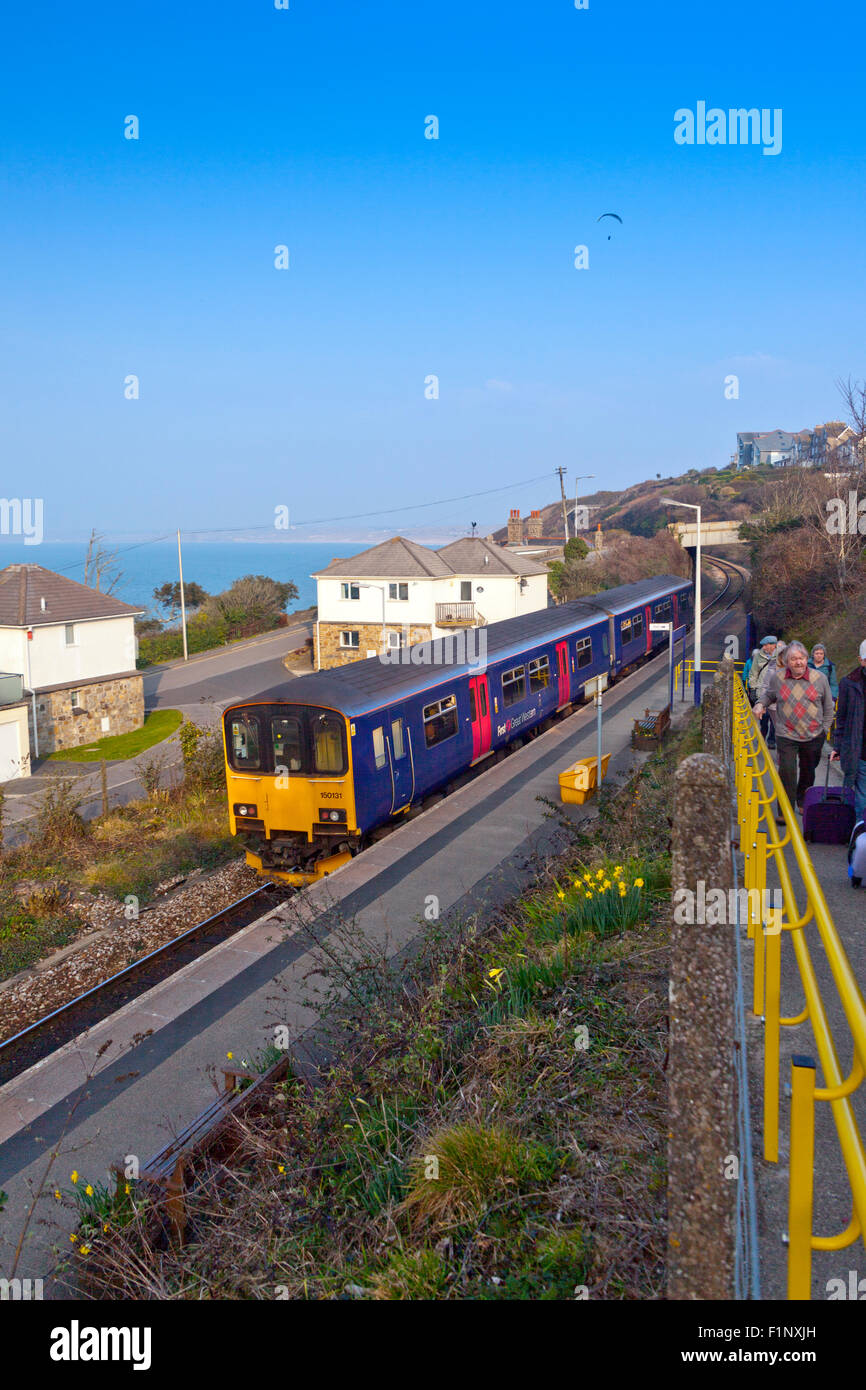A St Ives to St Erth branch line train leaving Carbis Bay station, Cornwall, England, UK Stock Photo