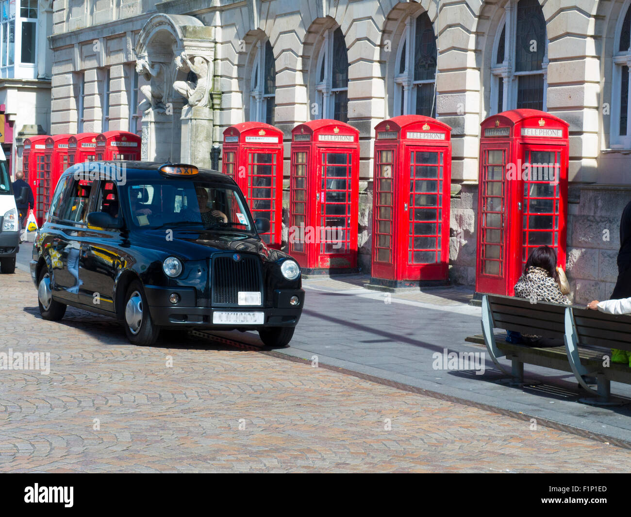 Red telephone boxes and black cab Blackpool Stock Photo Alamy