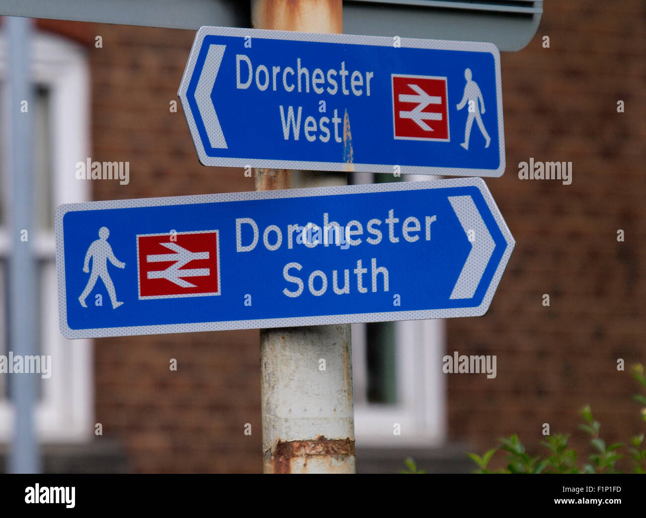 Direction signs for Dorchester West and South railway stations, Dorchester, Dorset, UK Stock Photo