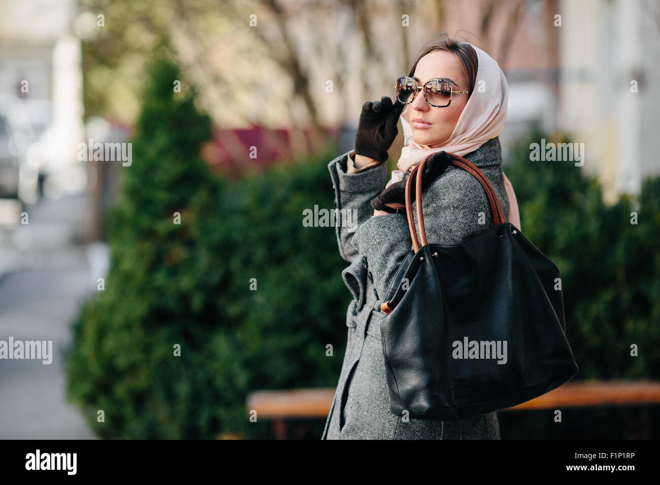 Happy young beautiful girl posing in the park Stock Photo - Alamy