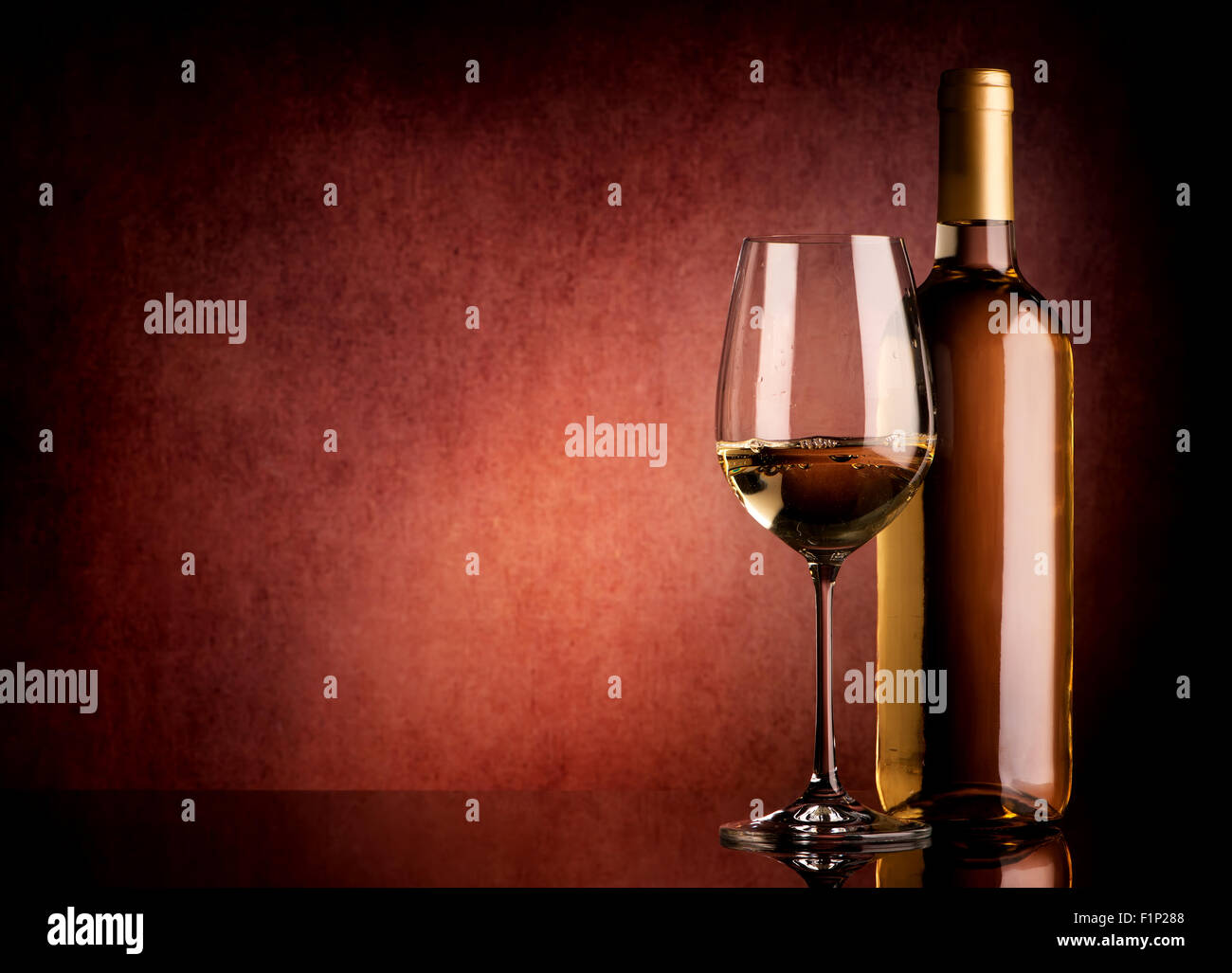 Festive white wine on a brown background Stock Photo