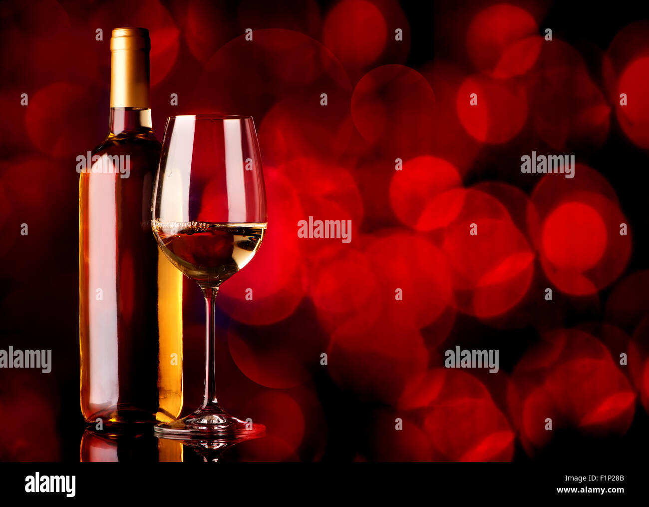 Festive white wine on a red background Stock Photo