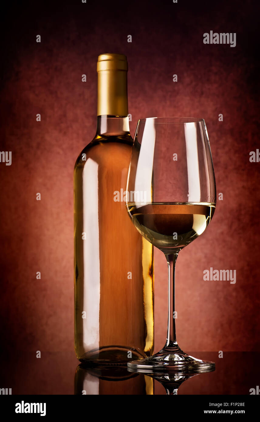 Semi-dry white wine on a brown background Stock Photo