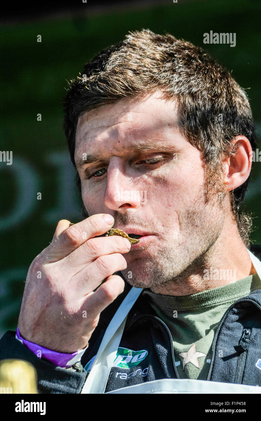 Motorcyclist and television presenter Guy Martin (Tyco BMW Motorrad Racing) tries, but doesn't enjoy, an oyster at the Hillsborough International Oyster Festival. Stock Photo