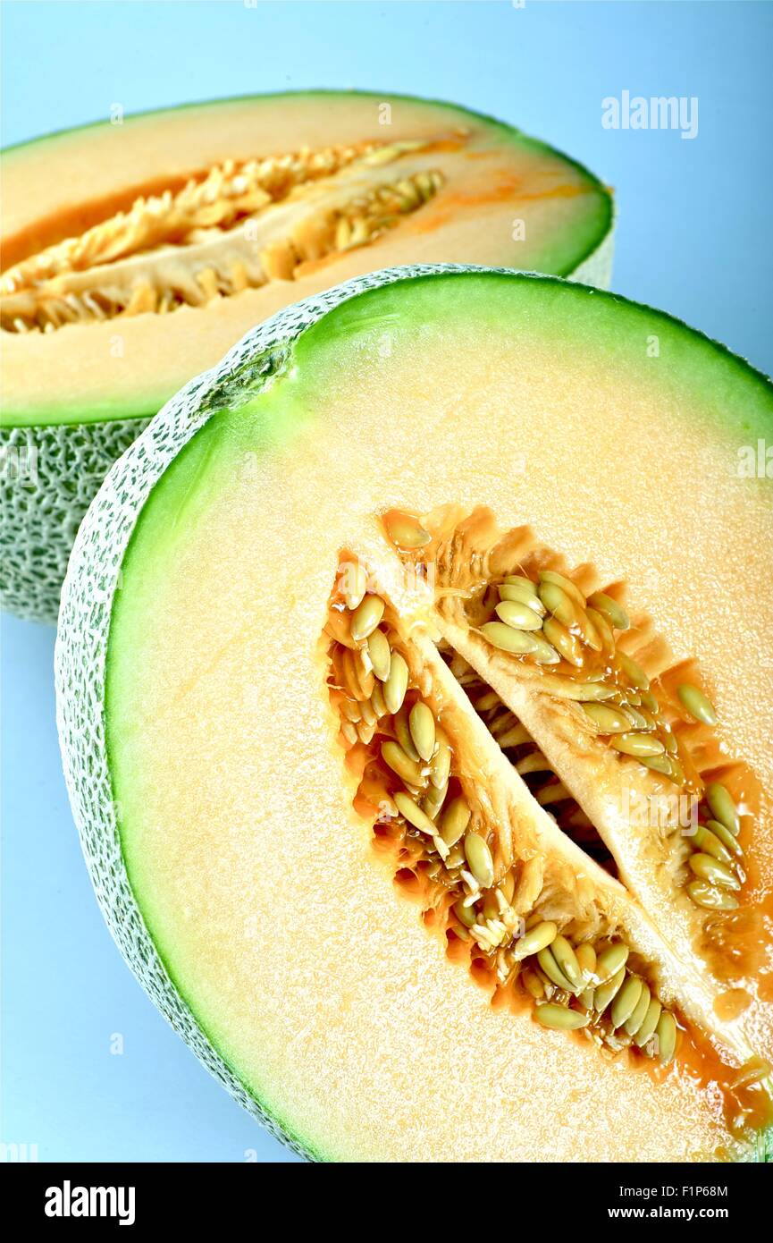 Cantaloupe Fruit Vertical Closeup Photo. Fresh Open Cantaloupe. Food Photo Collection Stock Photo