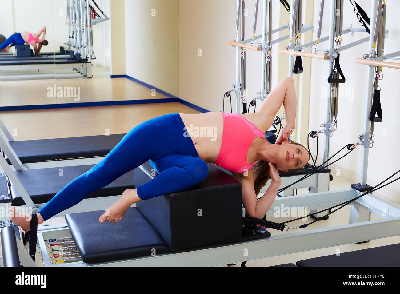 Pilates reformer woman short box side stretch exercise wrkout Stock Photo -  Alamy