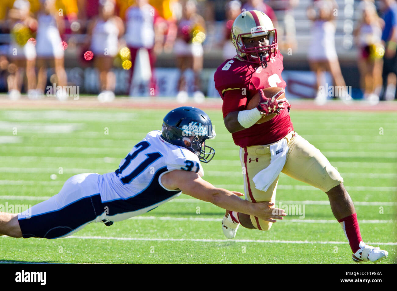 Chestnut Hill, MA, USA. 5th September, 2015. Maine Black Bears punter James DeMartini (31) dives to tackle Boston College Eagles wide receiver Sherman Alston (6) during the second half of the NCAA football game between the Boston College Eagles and Maine Black Bears at Alumni Stadium. Boston College defeated main 24-3. Anthony Nesmith/Cal Sport Media Stock Photo
