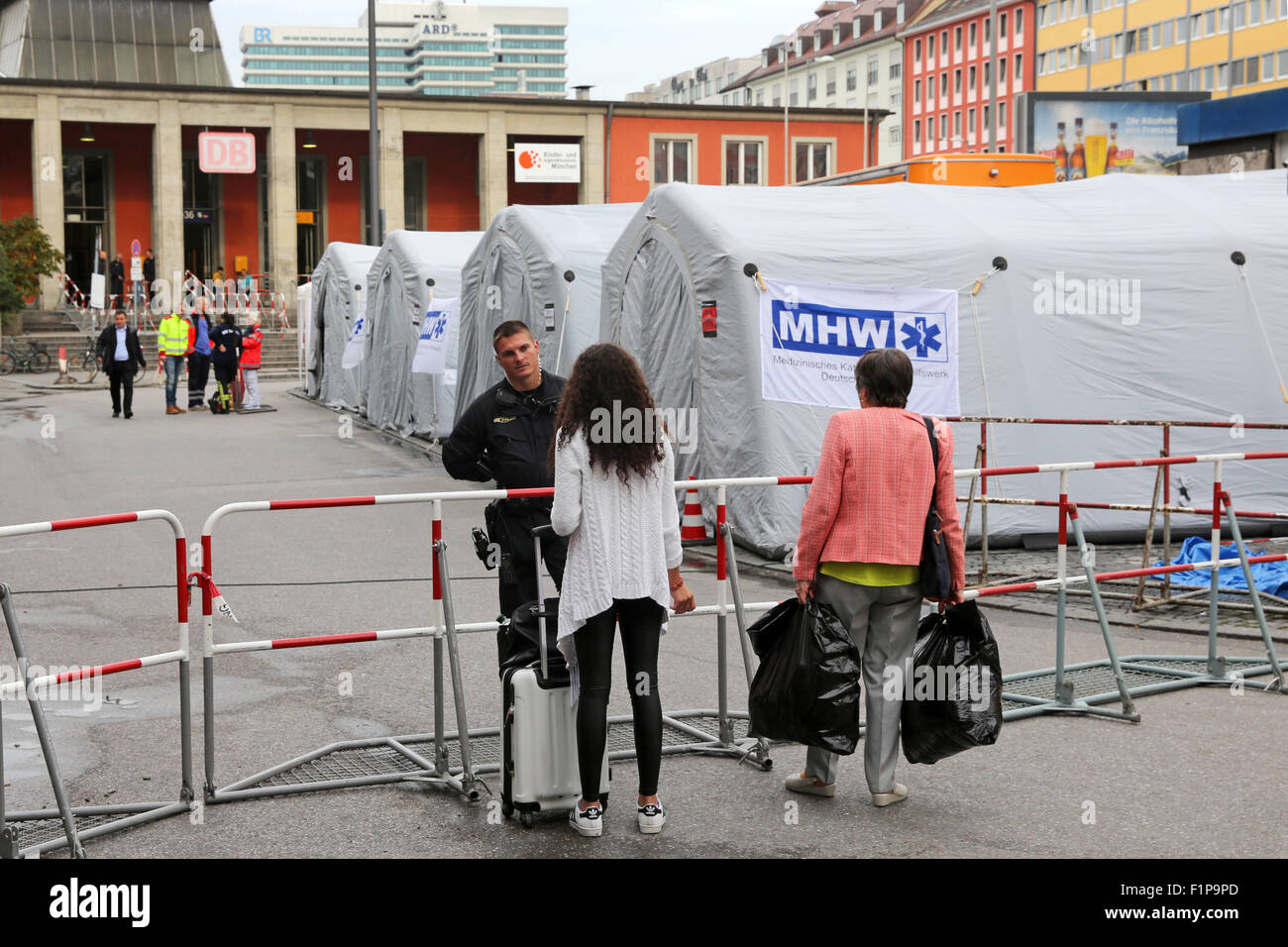 Tents for medical treatment of Migrants from Afghanistan who arrive with trains from Budapest/Hungary at Munich Hauptbahnhof main railway station in Munich, Germany. Thousands of migrants are traveling to Germany via Turkey, Greece, Montenegro, Serbia, Hungary and Austria. Stock Photo