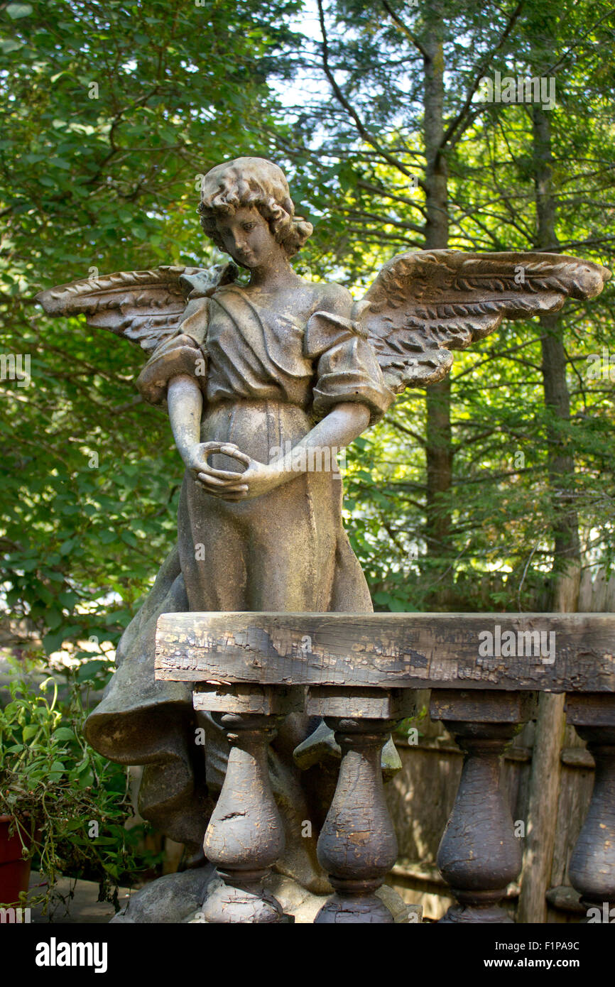 Angel statue in a forest. Stock Photo
