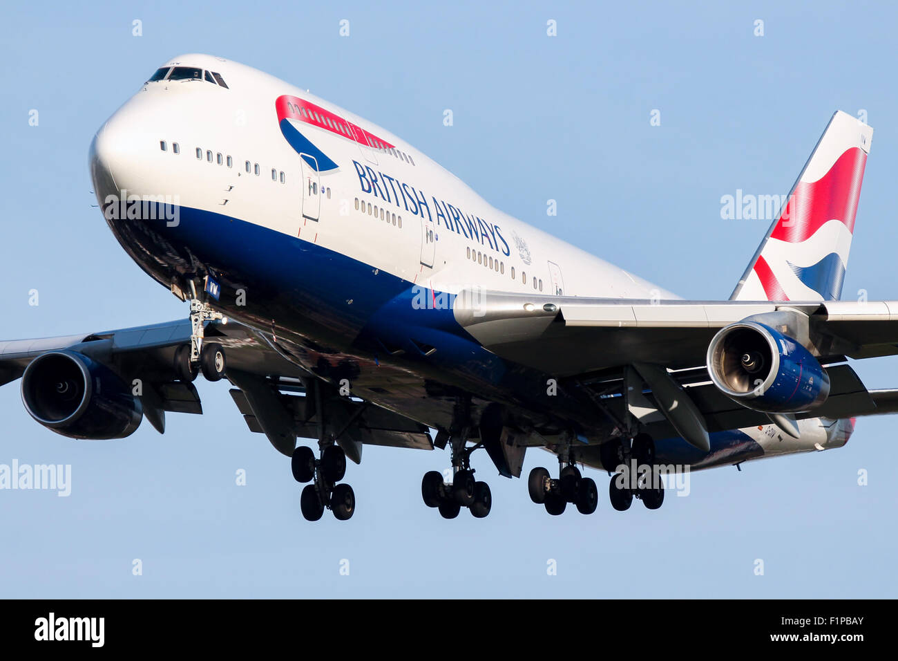British Airways Boeing 747-400 approaches runway 27L at London Heathrow airport. Stock Photo