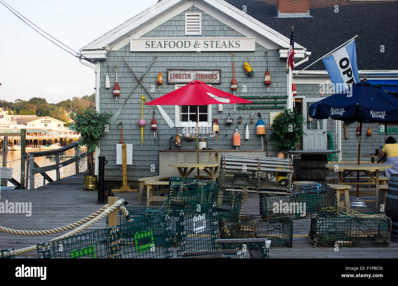 Lobster traps drying in front of a seafood restaurant on the harbor in Boothbay, Maine. Stock Photo