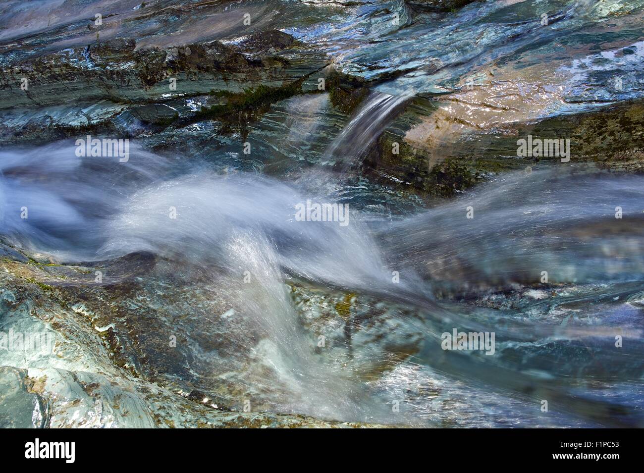 Rock and Water. Mountain Stream Thru Rock Formations Closeup. Nature Photo Background Collection. Stock Photo