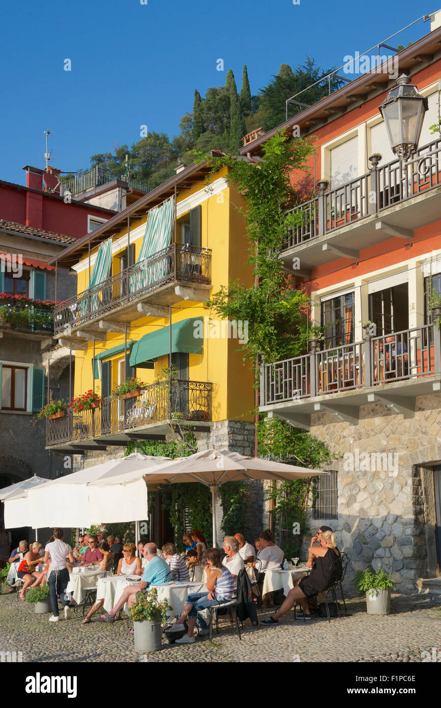 People enjoying a meal waterfront restaurant Varenna Lake Como Lombardy Italy Stock Photo