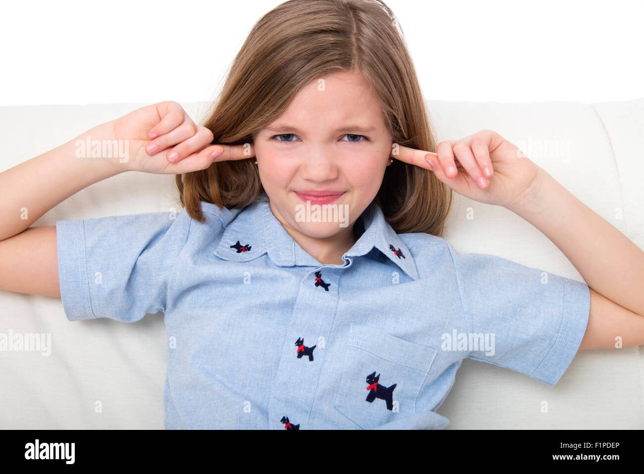 MODEL RELEASED. Girl with her fingers in her ears Stock Photo Alamy