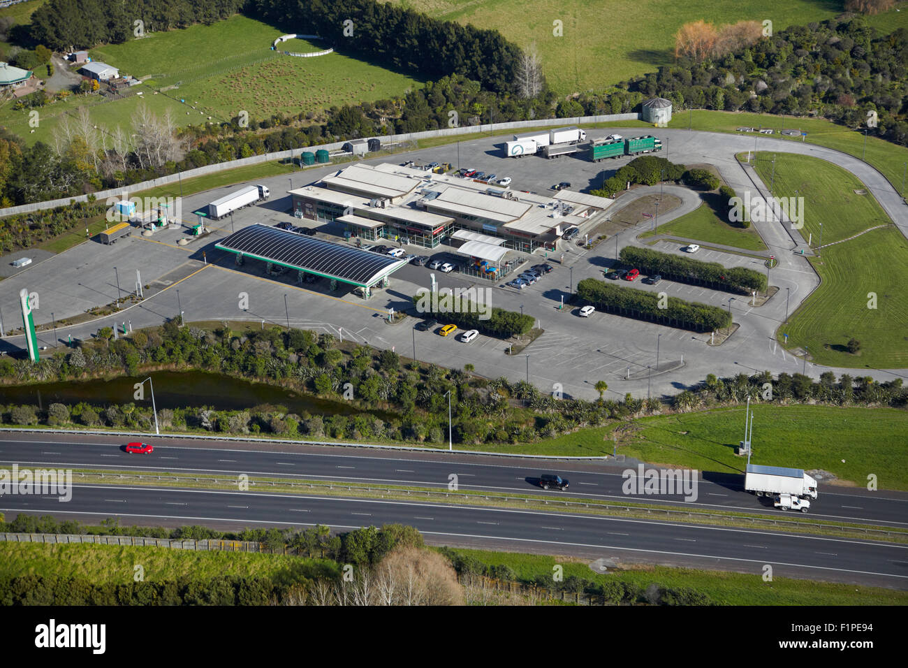 Service Station and Northern Motorway, Dairy Flat, Auckland, North Island, New Zealand - aerial Stock Photo